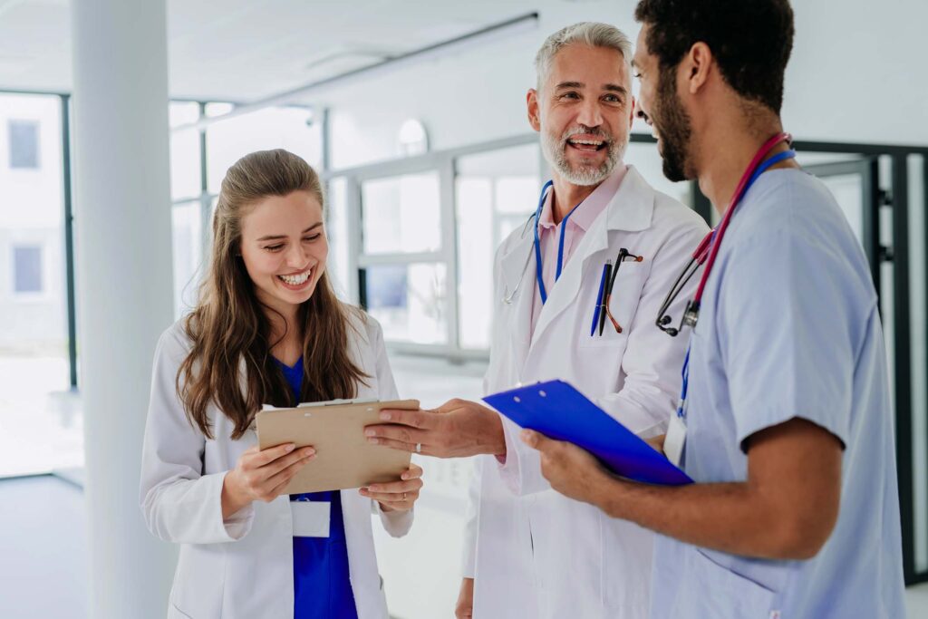 team of doctors discussing something at hospital c FHAY6CS.jpg